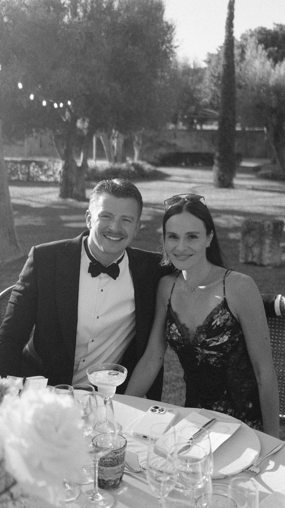 Black and white photo of Holly Ramsay and Adam Peaty at a wedding