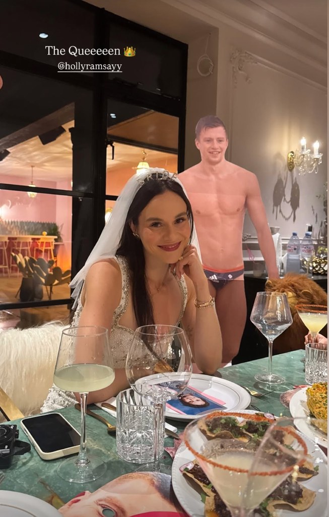 A photo of Holly Ramsay sitting at a dinner table