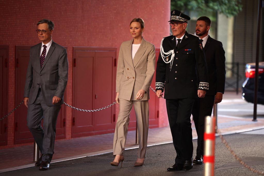 Princess Charlene of Monaco with her brother Gareth Wittstock (R) and Director of Public SuretÃ© of Monaco Eric Arella (2R) arrive for the presentation of the canine brigade in The Principality of Monaco on October 27, 2025. The princess is the initiator of the creation of the canine brigade and she is president of SPA Monaco (Societe Protectrice des animaux) (Photo by Valery HACHE / AFP) / / NO TABLOIDS WEB & PRINT, NO DAILY MAIL, NO DAILY MAIL GROUP, NO VOICI, NO CLOSER (Photo by VALERY HACHE/AFP via Getty Images)          