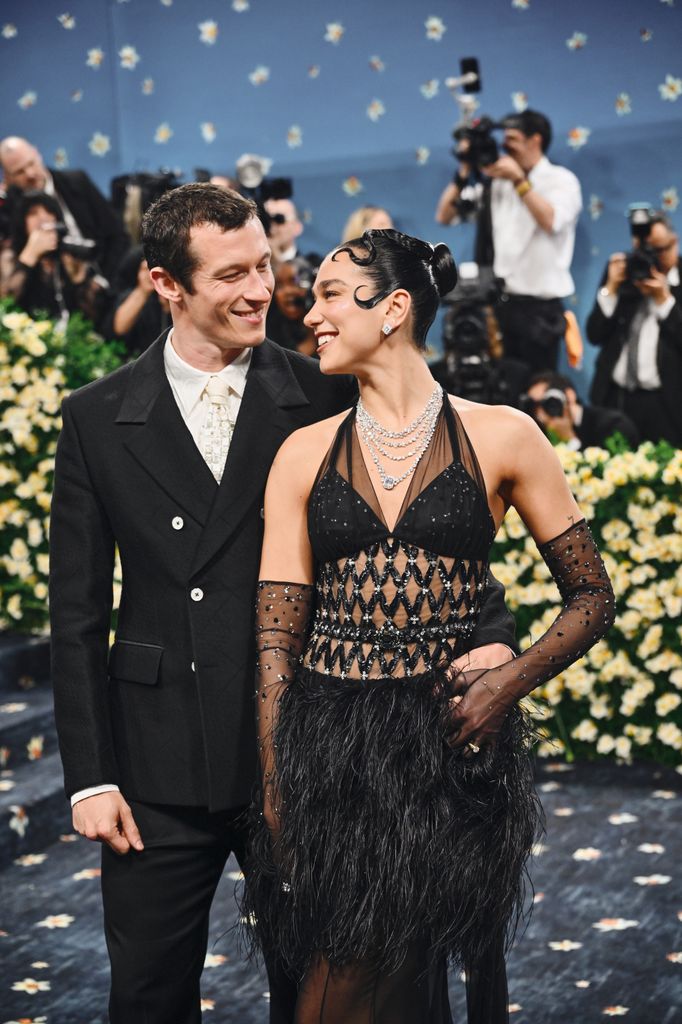 dua lipa and callum turner starring at each other met gala 2025