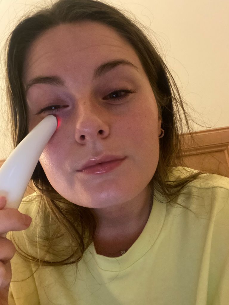 young woman using an eye wand