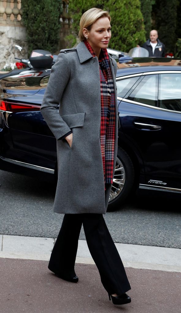 Princess Charlene in grey coat and red scarf