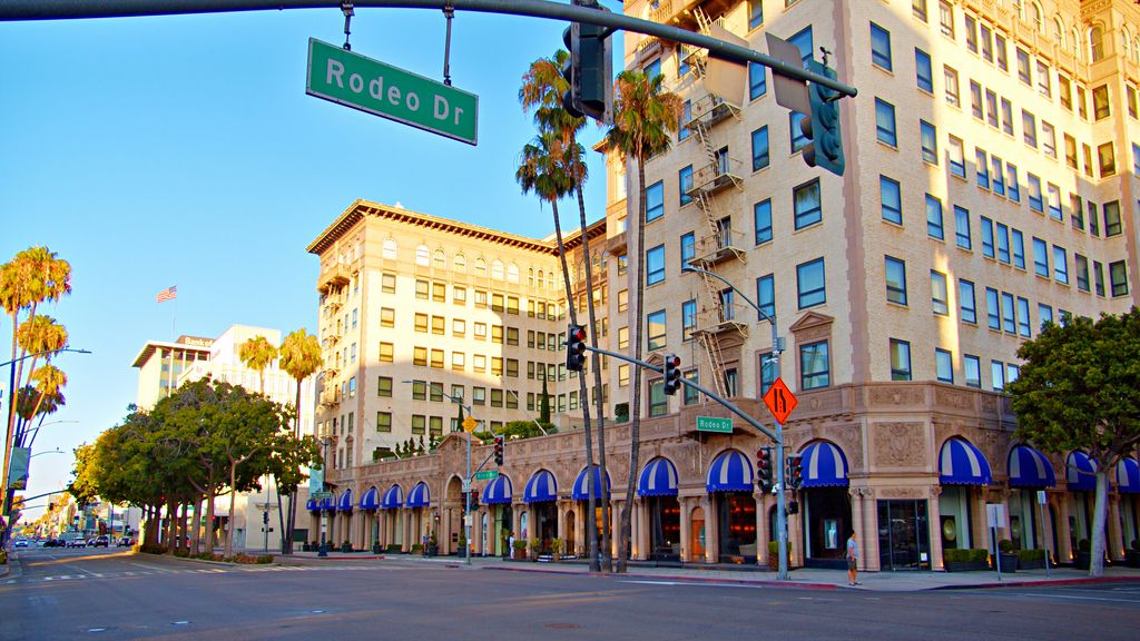 Stock image of restaurant and high ride building in the background with a street sign reading 'Rodeo Drive'