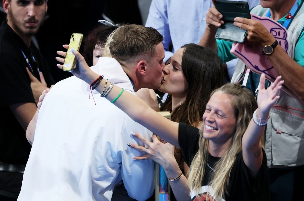 couple sharing kiss at olympics