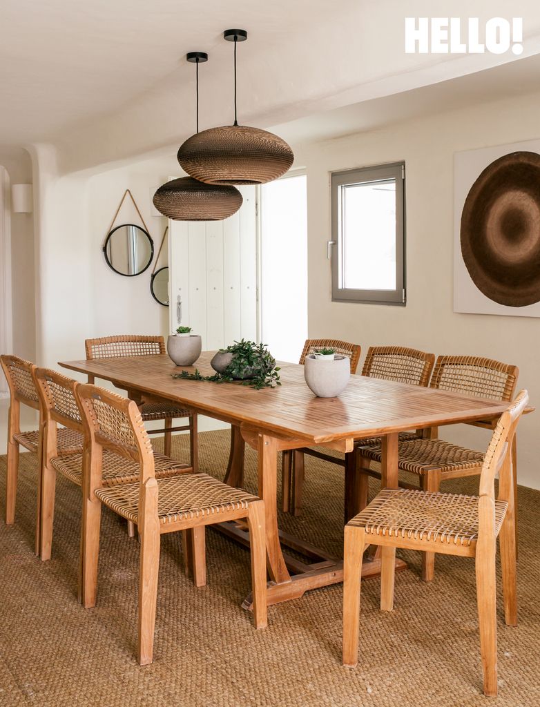Another dining room with wooden table and chairs in the Mykonos home