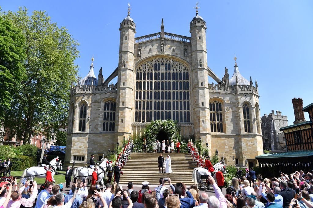 Prince Harry and his wife Meghan Markle leave their wedding ceremony at St George's Chapel, Windsor Castle