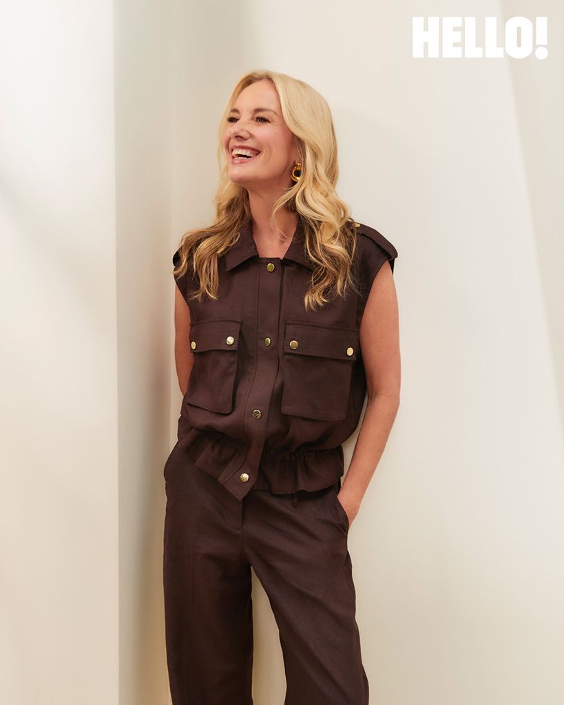 Tamzin Outhwaite in brown outfit smiling