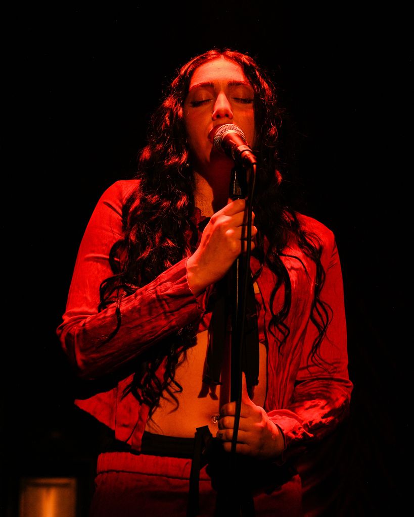 lourdes leon singing on stage