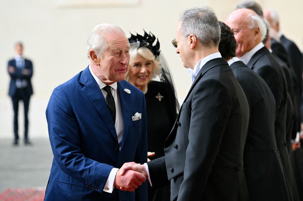 The King and Queen are welcomed by officials at San Damaso courtyard upon a meeting with Pope Leo IV        