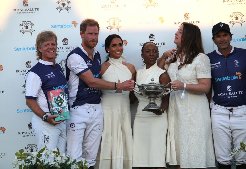 Dr Sophie Chandauka with Prince Harry and Meghan Markle at a Sentebale polo match in April last year