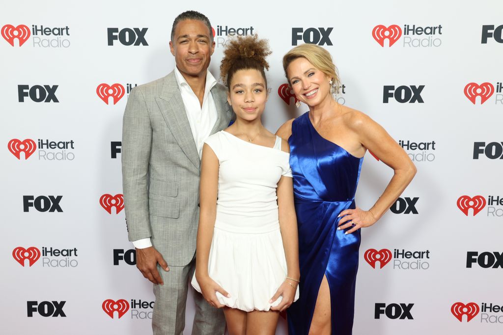 T. J. Holmes, Sabine Holmes and Amy Robach attend the 2025 iHeartRadio Music Awards at Dolby Theatre in Los Angeles, California on March 17, 2025. Broadcasted live on FOX