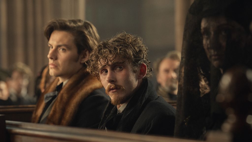 two men sitting on church pew