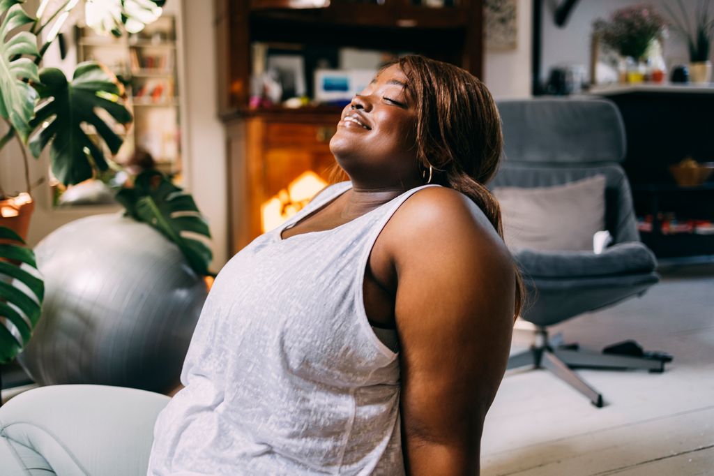 Afro-American woman relaxing after a workout.
