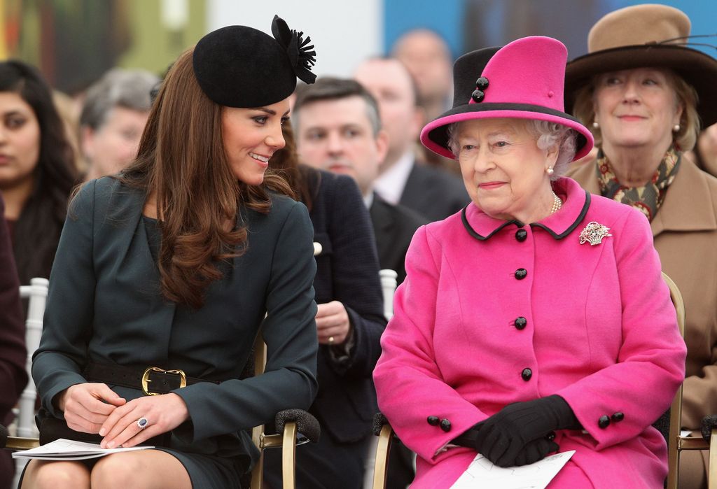 Kate Middleton sitting with the late Queen