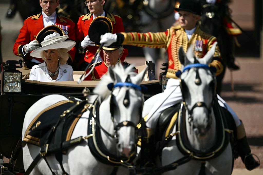 Britain's King Charles III and Britain's Queen Camilla make their way from Buckingham Palace to Horse Guards Parade for the King's Birthday Parade, "Trooping the Colour"