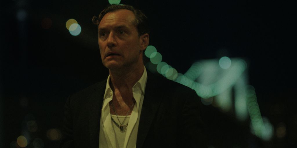 man standing outdoors at night