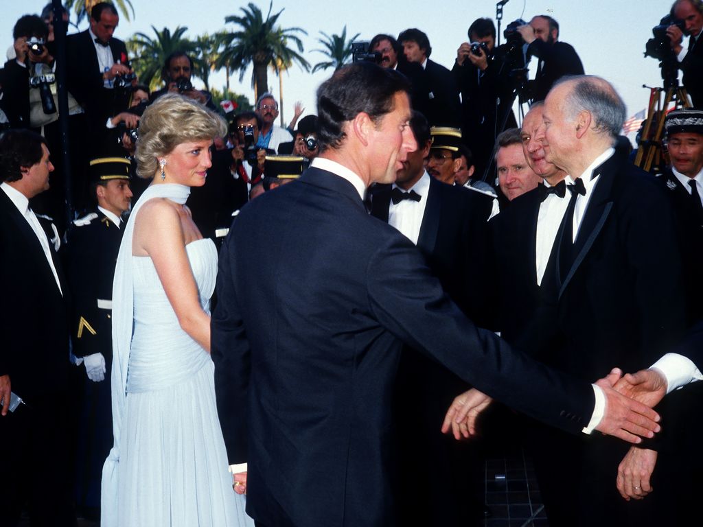 Who can forget Princess Diana's iconic Cannes Film Festival dress with the unique neck scarf detail? 