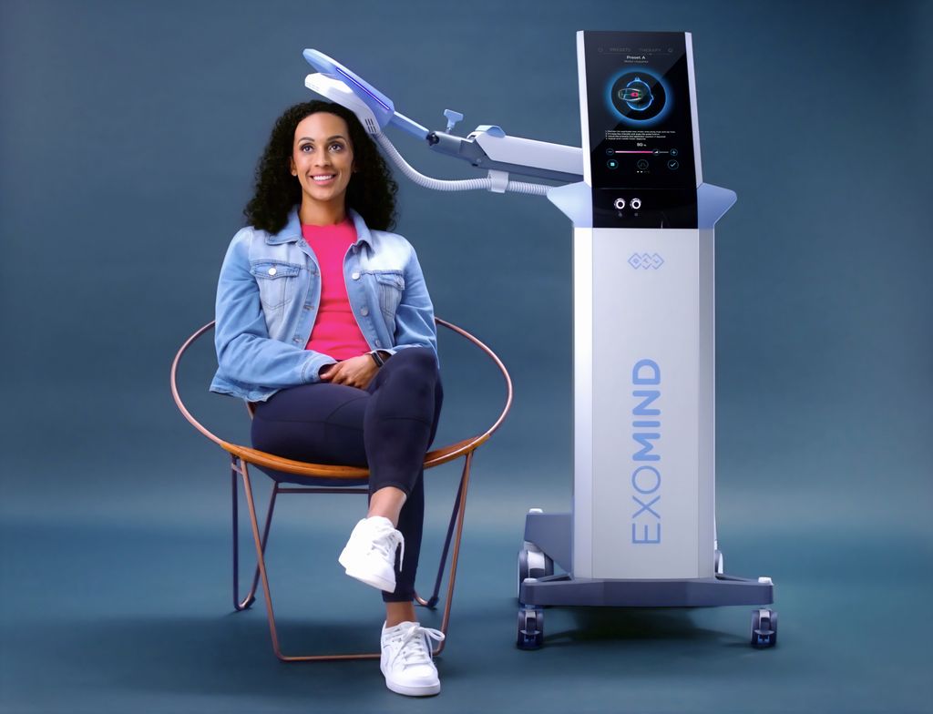 Woman having Exomind treatment in chair 