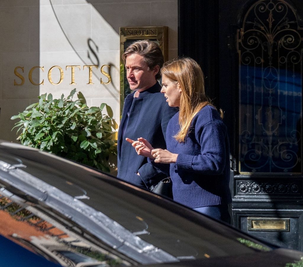 Princess Beatrice checks her phone outside Scotts with Edoardo Mapelli Mozzi 