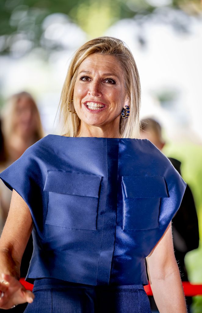 Queen Maxima in a blue dress