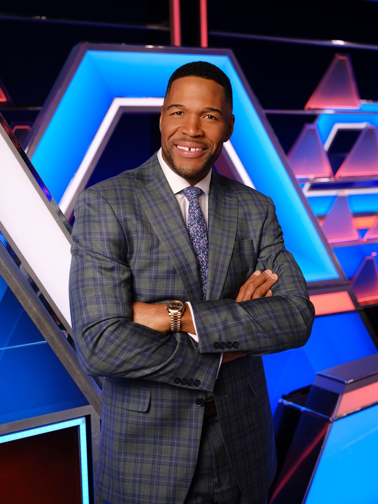 MICHAEL STRAHAN POSES ON THE $100K PYRAMID SET