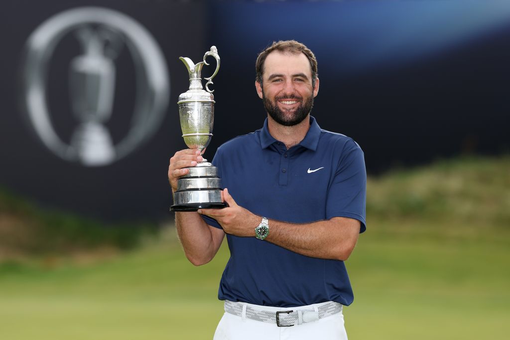 scottie scheffler holding the claret jug after winning the open at royal portrush