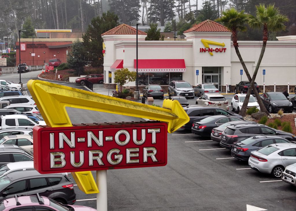 An aerial view of an In-N-Out Burger restaurant on July 21, 2025 in Daly City, California. In-N-Out Burger heiress and CEO Lynsi Snyder announced that she will be relocating her family from California to Tennessee, citing the challenges of raising a family and running a business in the state. In-N-Out has more than 280 restaurants in eight states. 