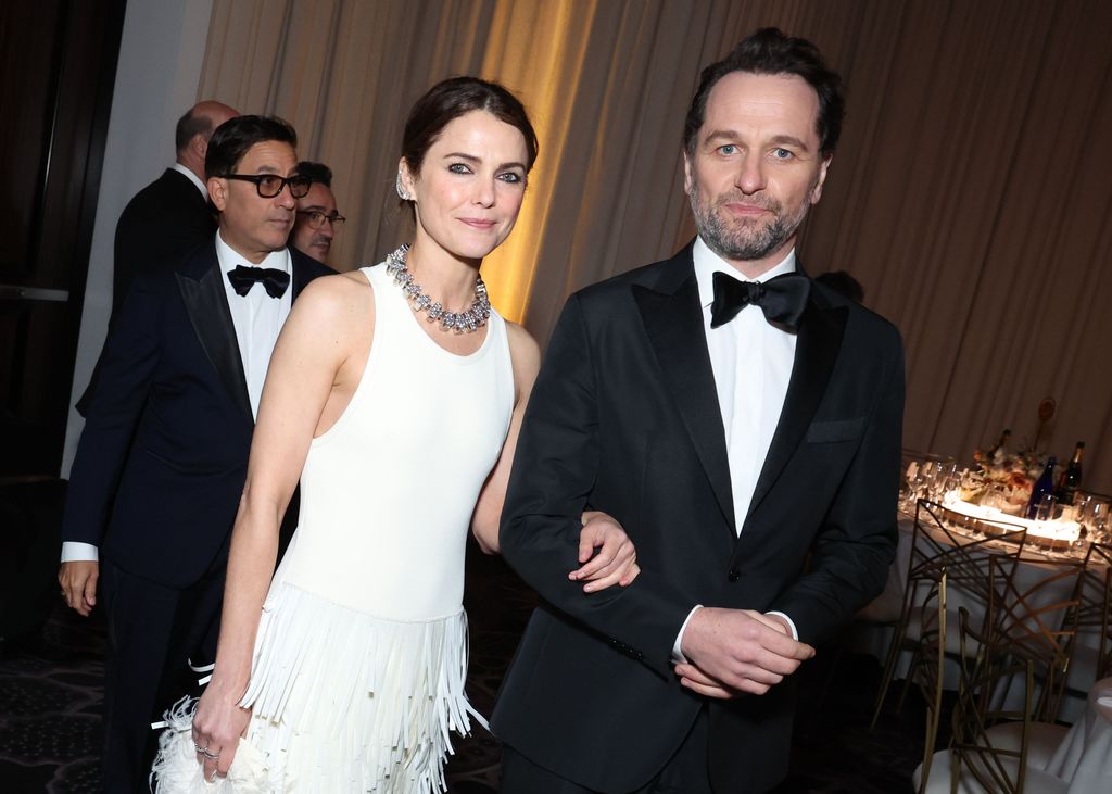 Man and woman posing for photo