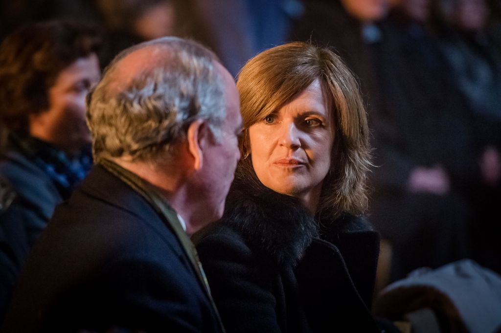 man and women sitting in crowd