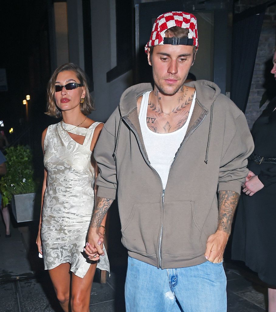 Hailey Bieber in white dress and Justin Bieber in gray hoodie seen leaving L'artusi 