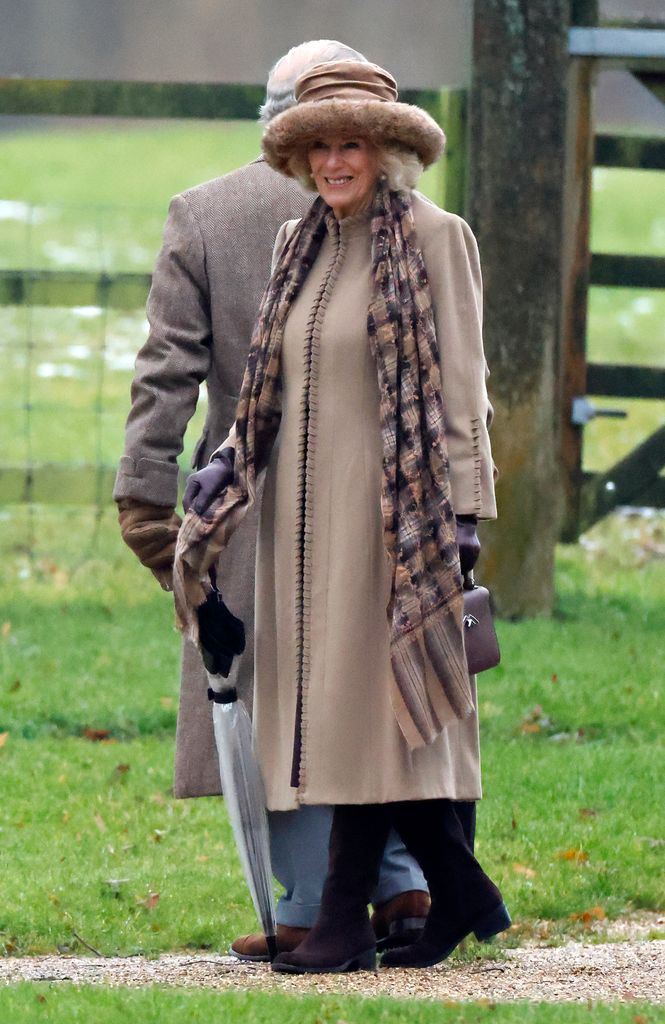 Queen Camilla outside in beige coat and hat