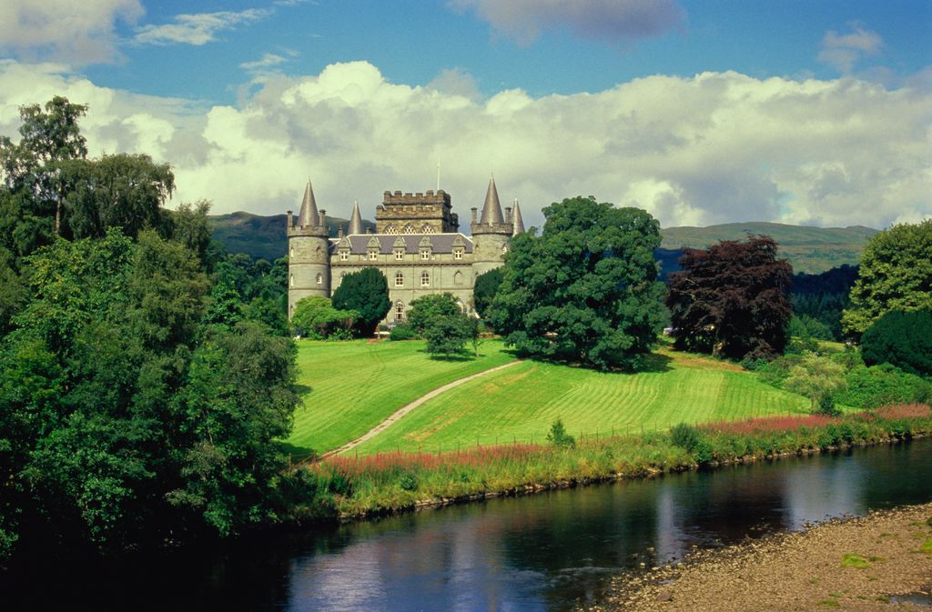 Scotland,Inverary,Inverary Castle riverbank in foreground.