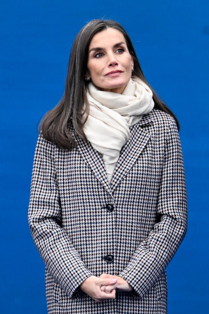 Queen Letizia  in houndstooth coat with a plain scarf
