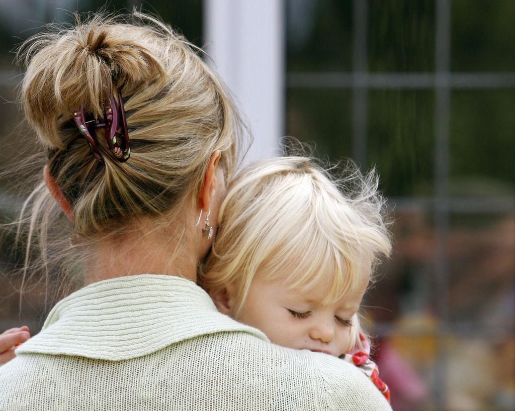 Kate McCann carries one of her twins, Amelie