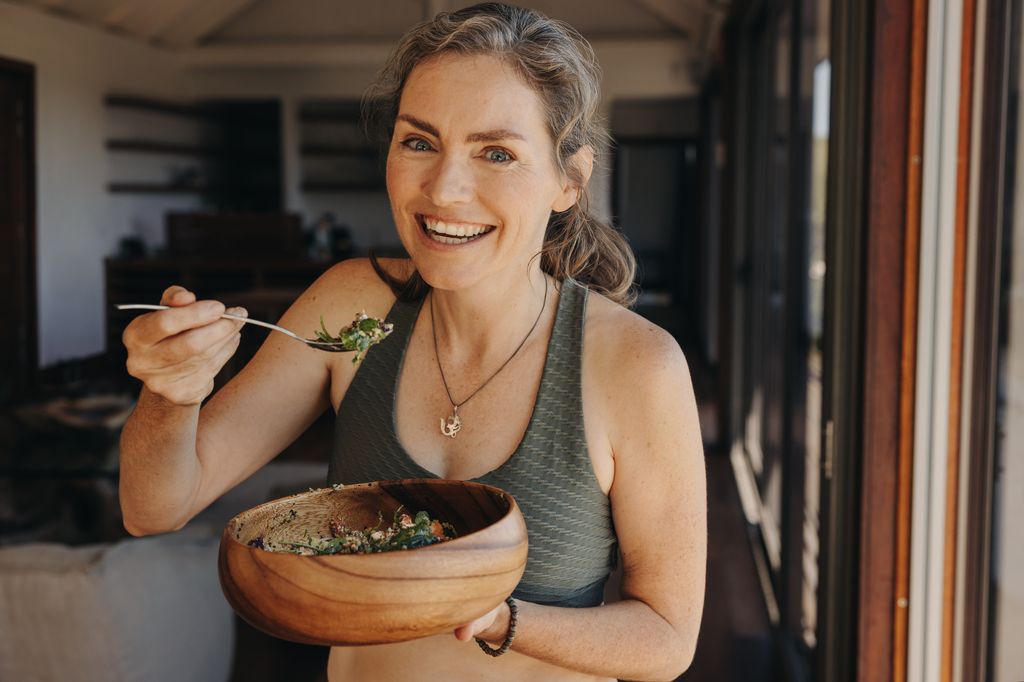 older woman eating salad