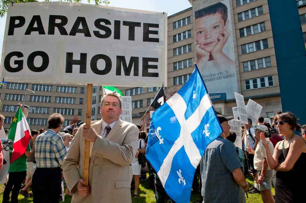 People protest against the visit of Prince William and Catherine outside the Saint-Justine children hospital in Montreal on July 2, 2011