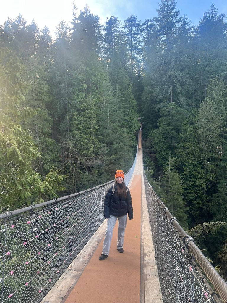 Shot of writer on the Capilano Suspension Bridge across the park