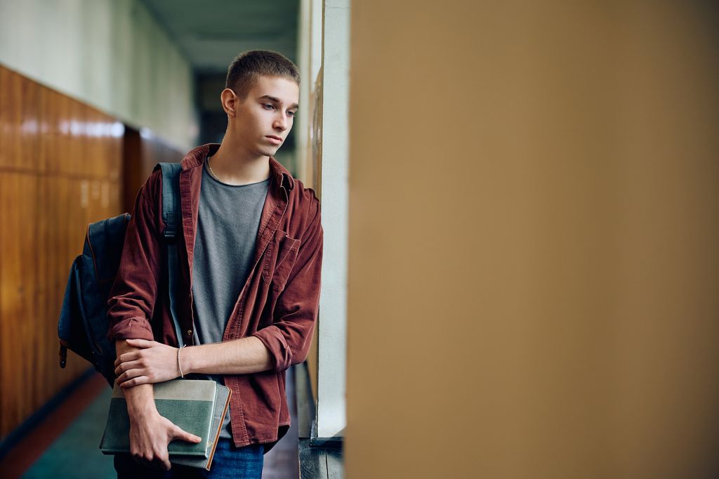 demanding teen boy at school.