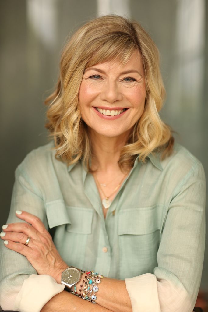 Smiling woman in a green shirt