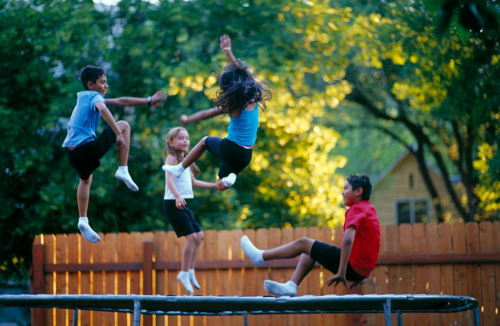 Kids bouncing on trampoline