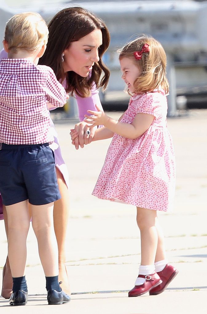 Kate bending to talk to charlotte