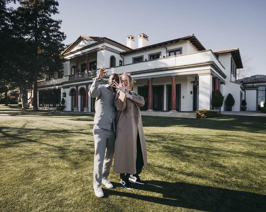 Adele and Rich Paul posing for a photo outside their home