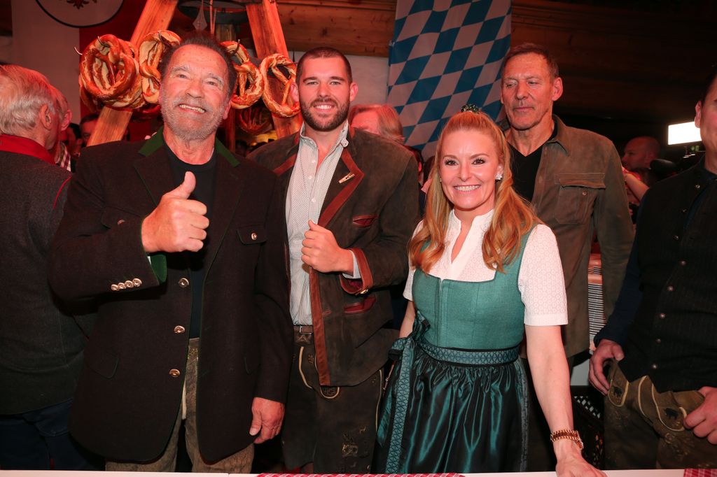 Arnold Schwarzenegger his son Christopher Schwarzenegger and Heather Milligan at Hotel Stanglwirt on January 19, 2024 in Going near Kitzbuehel, Austria