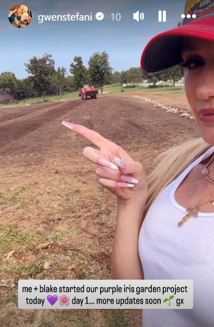 photo of gwen stefani pointing at soil on ranch