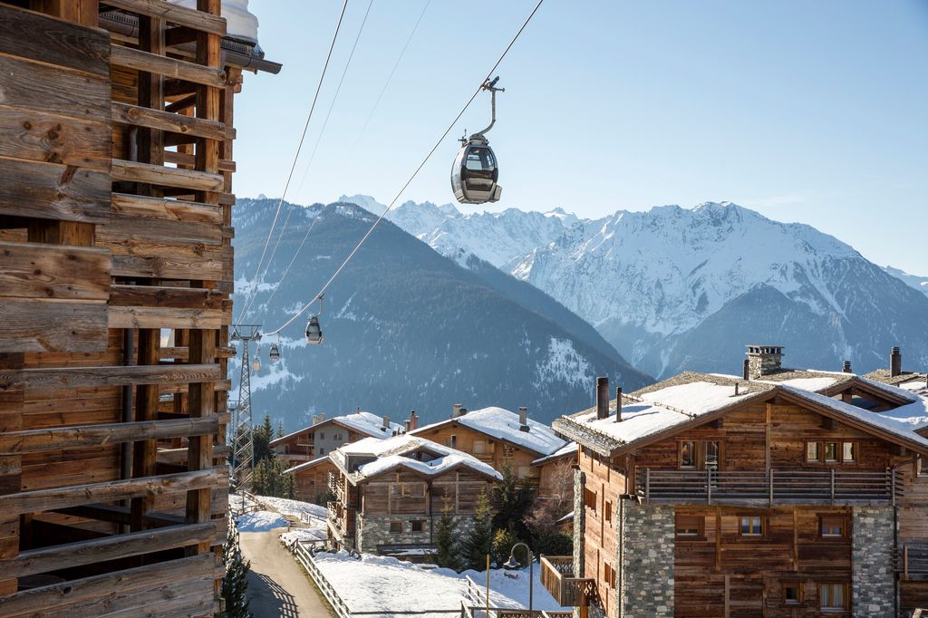 ski lift with mountains in the background