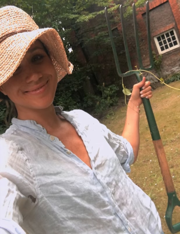Meghan Markle is all smiles in sun hat and shirt for gardening at home |  HELLO!