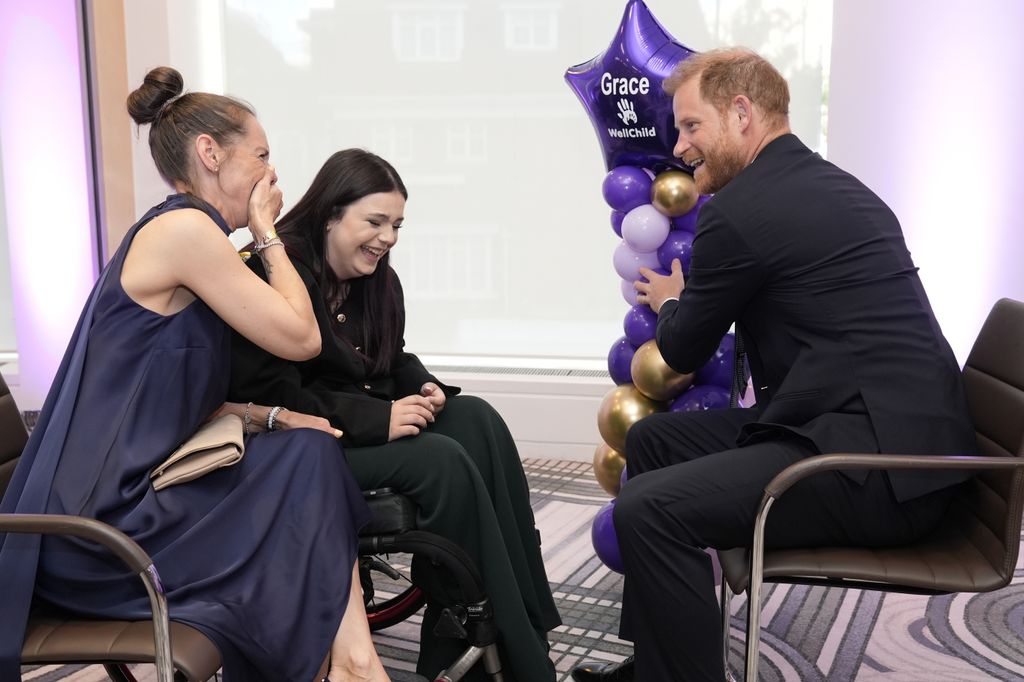 Prince Harry laughs with 13-year-old Grace, recipient of the Special Recognitions award