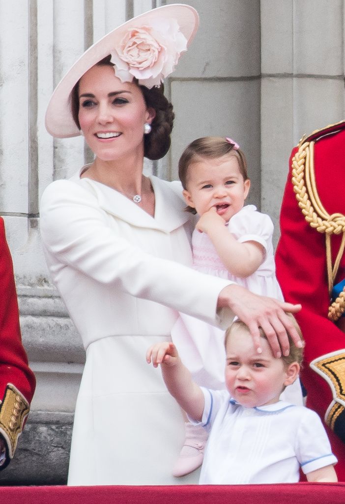 Catherine, Duchess of Cambridge, Princess Charlotte, Prince George stand on the balcony during the Trooping the Colour, this year marking the Queen's official 90th birthday at The Mall on June 11, 2016 in London, England. The ceremony is Queen Elizabeth II's annual birthday parade and dates back to the time of Charles II in the 17th Century when the Colours of a regiment were used as a rallying point in battle.  (Photo by Samir Hussein/WireImage)
