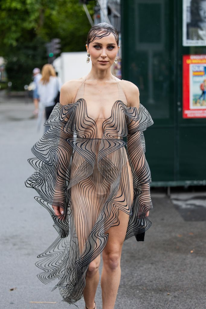 Mary Leest wears transparent dress outside Iris van Herpen during the Haute Couture Fall/Winter 2025/2026 as part of Paris Fashion Week on July 07, 2025 in Paris, France. (