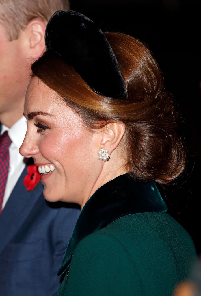 Catherine side on wearing black padded headband